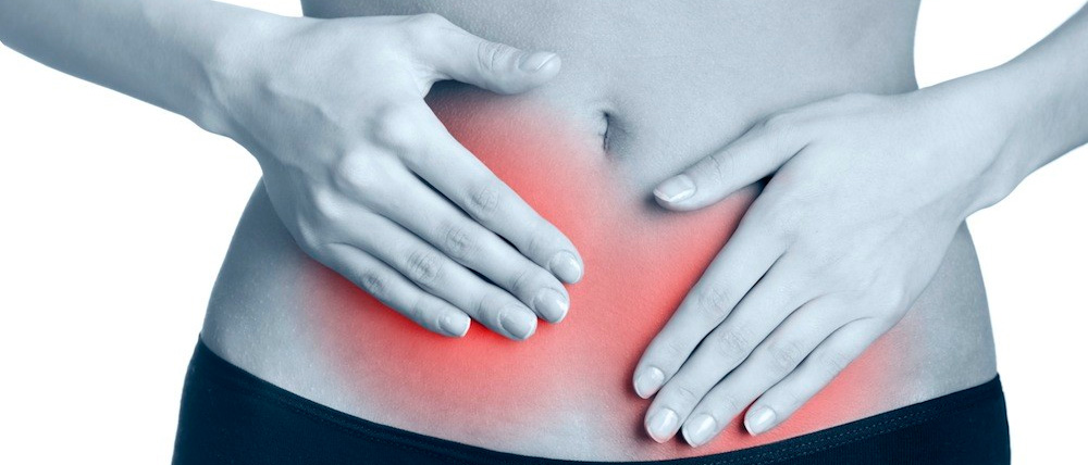 Боль в животе у женщины